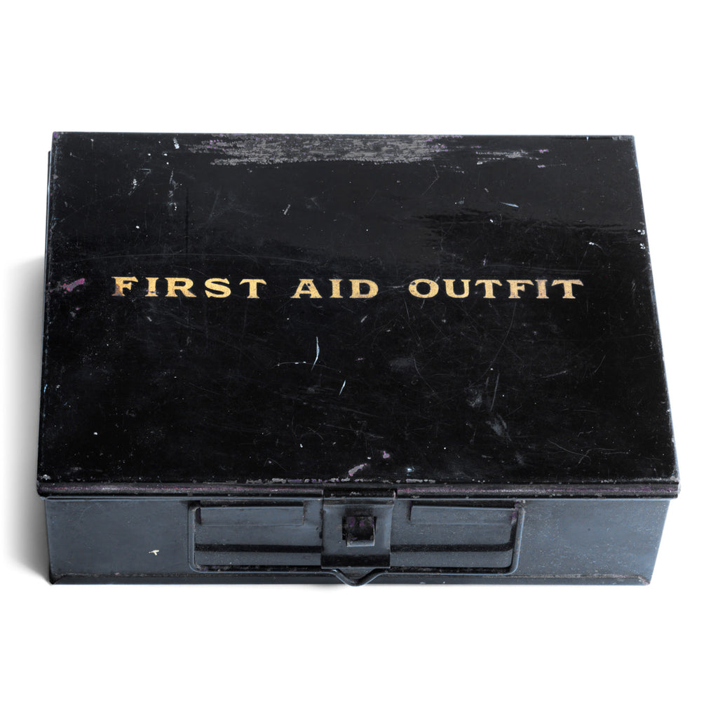 A good-looking 1920s first aid tin, the lid stencilled "First Aid Outfit". It has a carrying handle and fastening hasp, and it has its original black enamel paint finish.