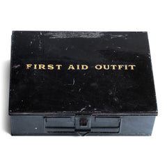 A good-looking 1920s first aid tin, the lid stencilled "First Aid Outfit". It has a carrying handle and fastening hasp, and it has its original black enamel paint finish.