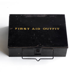 A good-looking 1920s first aid tin, the lid stencilled "First Aid Outfit". It has a carrying handle and fastening hasp, and it has its original black enamel paint finish.