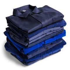 A collection of cobalt-blue, denim-blue and grey cotton vintage French work jackets.