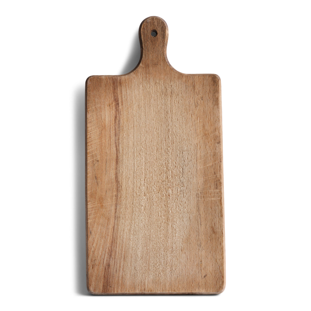 A charming and well scrubbed vintage chopping board with handle and hanging hole