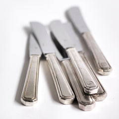 Vintage hotel ware silver-plated WMF butter knives, made for Holland & America Line, the cruise liner company