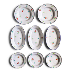 A wonderful, rare antique doll's enamel dinner service decorated with rose buds and leaf sprigs, and each piece finished with a blue trim; very much in tune with the current trend "cottage core", an aesthetic which celebrates an idealised rural life. This is part of an extensive collection of miniature enamel kitchen ware, previously owned by the late miniaturist specialist and collector extraordinaire Joan Dunk.