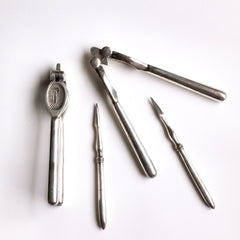 A good boxed set of vintage silver-plated nut crackers and nut picks.  Our vintage silver-plated EPNS (electro-plated nickel silver) nut crackers and picks are both good-looking and functional, and their renewed popularity make them a cool addition on today’s table. Length of nut crackers 14cm Country of origin: UK Date of manufacture: c.1930 Material: EPNS (electro-plated nickel silver) Condition: pristine - probably never used.