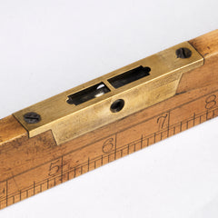Carpenter's combined spirit level and inch rule.