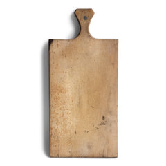 A charming vintage chopping board with handle and hanging hole.