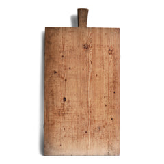 A large vintage rectangular scrubbed pine German baker's board with handle and cross baton supports to its underside.
