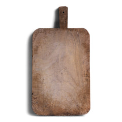 A rustic antique vintage chopping board with a beautiful time-worn, knife-cut patina, full of character and warmth.