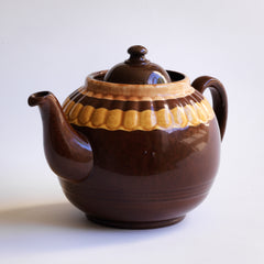 A good large 6 cup original Brown Betty teapot with mustard banding and raised pie-crust style fluting.
