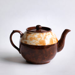 A good 4 cup original Brown Betty teapot with a deep marbled band, along with a fine beaded relief between the marbled band and main body of the teapot.