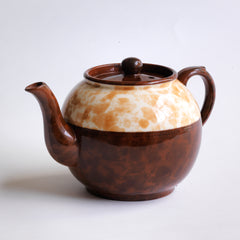 A good 4 cup original Brown Betty teapot with a deep marbled band, along with a fine beaded relief between the marbled band and main body of the teapot.