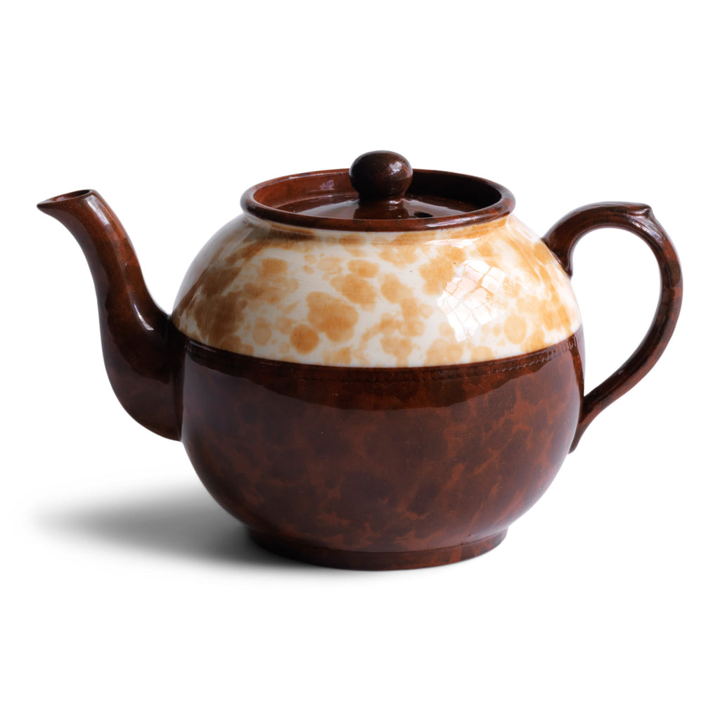 A good 4 cup original Brown Betty teapot with a deep marbled band, along with a fine beaded relief between the marbled band and main body of the teapot.