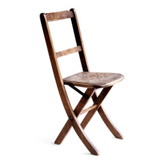 An elegant Edwardian folding child's chair, which was purchased some years back directly from the church hall in Winchelsea, East Sussex, UK. The seat is of ply with pierced holes arranged in a star shaped pattern. The frame is beautifully constructed and designed to fold flat when not in use, and so can easily be stored.