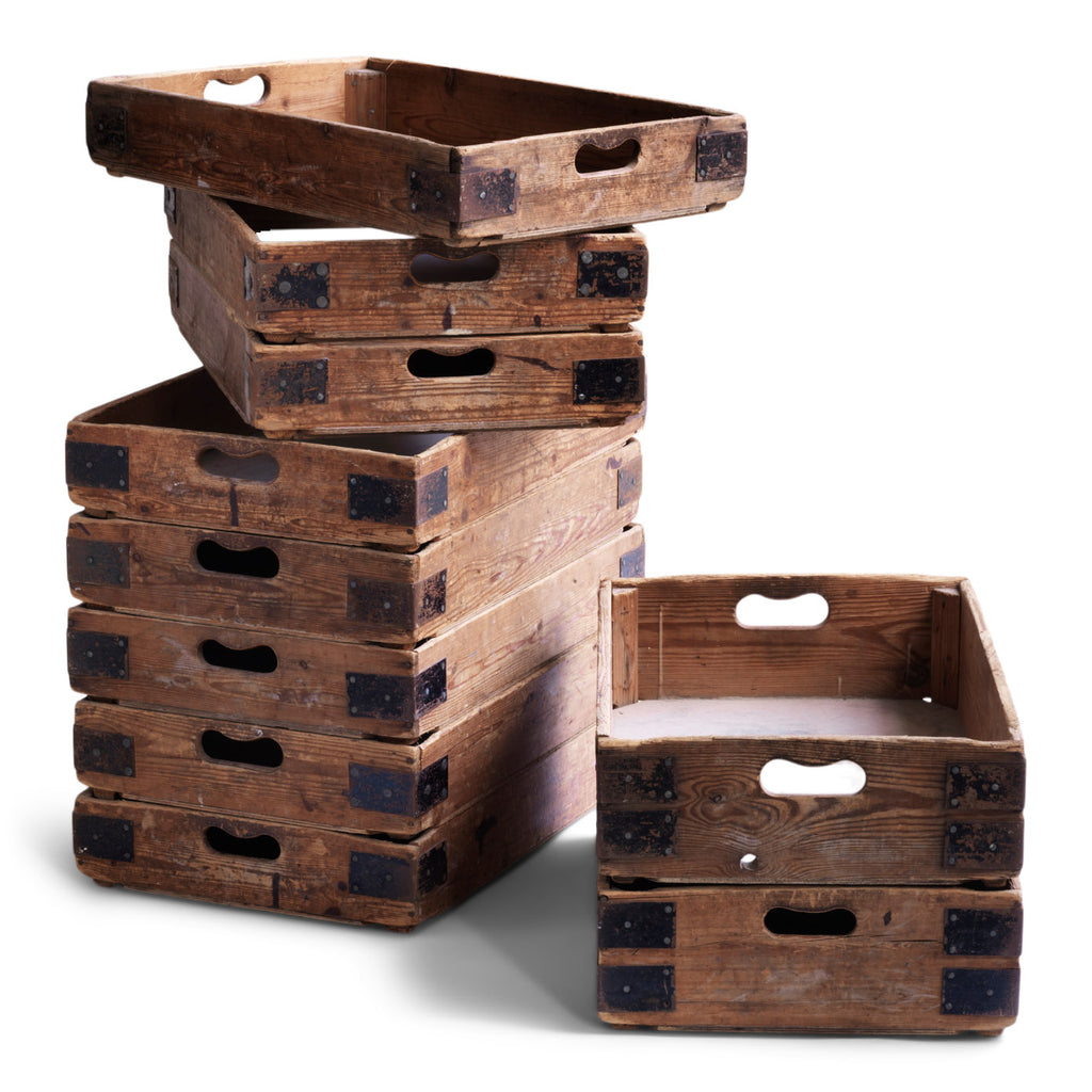 We have just ten of these wonderful vintage potter's crates. Once used in the Staffordshire potteries for transportation of greenware (unfired ceramics) to the kiln, each pine potter's tray has time-worn slot handles, metal corner braces, and a plywood base. They are great for home storage, as they can be stacked one on top of the other, and would work well in the kitchen, office or shed as sliding drawers under a table or other work surface.