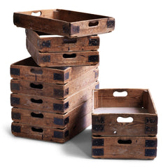 We have just ten of these wonderful vintage potter's crates. Once used in the Staffordshire potteries for transportation of greenware (unfired ceramics) to the kiln, each pine potter's tray has time-worn slot handles, metal corner braces, and a plywood base. They are great for home storage, as they can be stacked one on top of the other, and would work well in the kitchen, office or shed as sliding drawers under a table or other work surface.