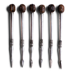 A rare set of 1930s silver-plated nut picks designed to wheedle out every last nugget of flesh from a walnut shell - always the difficult nut to dissect. They have a wonderful weight and beautifully turned, polished handles with a miniature walnut modelled in wood at the end of each.