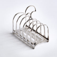 An Edwardian silver plated hooped toast rack with top carrying handle and scalloped sides, designed to take 6 slices of toast.  It has good weight and a succession of silver marks on its underside.