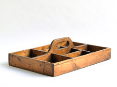 A well proportioned antique stained pine housekeeper's tidy with integrated handle. It could also be used to house utensils, tools, artist's materials or act as a shoe cleaning box. In fact it's totally purposeful.