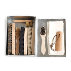 A complete set of handmade shoe brushes housed in a shoe brush tin
