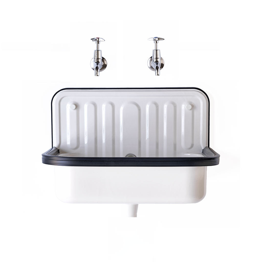 Designed in Germany in the 1930s, this enamel wall-mounted sink was originally intended for use in bucket rooms and outhouses.  Today its good looks have taken it to beyond utility use, and it now can look equally as good in the kitchen or bathroom, as well as the scullery or shed.