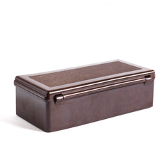 A 1930s Bakelite box with a hinged lid that has an integrated Bakelite hinge. 