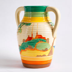 An original 1930s Clarice Cliff twin handle lotus jug in the Secrets pattern. The underside is stamped "Fantasque Hand Painted Bizarre by Clarice Cliff Newport Pottery England", and it's a good early one, dating to 1933; and better still, it is beautifully hand painted and in immaculate condition.