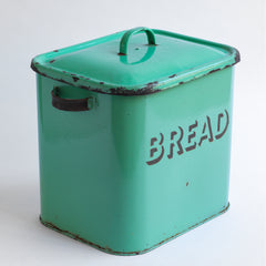 A 1930s rectangular green enamel bread bin with "BREAD" in 3-D black enamel, rounded corners and original lid.