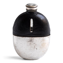 An early twentieth century silver plated, oval glass and black leather hip flask with a screw-cap top, most likely by James Dickson &amp; Sons, Sheffield. &nbsp;The clear glass body is half covered with leather, the lower half has a detachable silver plated EPNS cover that also acts as a cup