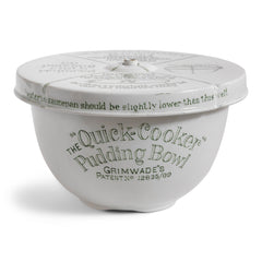 A vintage ironstone Grimwades pudding bowl with central heat funnel and fitted lid. The bowl and lid are liberally decorated with graphic typography and illustrations on how to use the Quick Cooker.