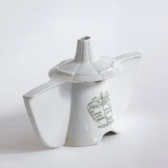 An antique Grimwades ironstone "Bleriot" combined pie funnel and pie divider.