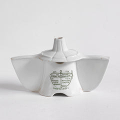 An antique Grimwades ironstone "Bleriot" combined pie funnel and pie divider.