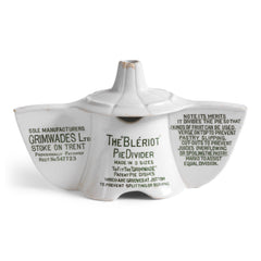 An antique Grimwades ironstone "Bleriot" combined pie funnel and pie divider.