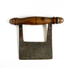 A Victorian kitchen herb chopper or dough scoop that has  a turned beechwood handle and carbon steel blade.