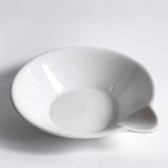 A super-large Victorian ironstone dairy pouring bowl by the "Dairy Supply Company London" (stamp applied to underside) with a rolled rim and a particularly striking pouring lip.