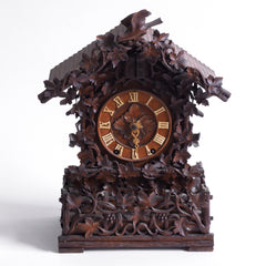 This stunning cuckoo clock, encrusted in a sleeping-beauty thicket of finely carved foliage is one of the first of its kind, and is by Johann Baptist Beha, the most prestigious of nineteenth century Black Forest clock makers. It’s early, a rarity, and few exist - and is known as model 509.