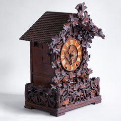 A stunning cuckoo clock, encrusted in a sleeping-beauty thicket of finely carved foliage is one of the first of its kind, and is by Johann Baptist Beha, the most prestigious of nineteenth century Black Forest clock makers. It’s early, a rarity, and few exist - and is known as model 509.