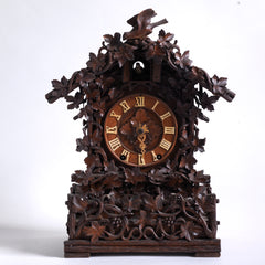 A stunning cuckoo clock, encrusted in a sleeping-beauty thicket of finely carved foliage is by Johann Baptist Beha, the most prestigious of nineteenth century Black Forest clock makers. It’s early, a rarity, and few exist - and is known as model 509.