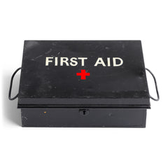 A good-looking first aid tin, the lid stencilled "First Aid" in sans serif and with a red cross. It has a pair of carrying handles and its original black enamel paint finish. 