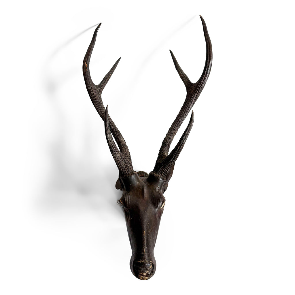 A stag head style trophy fashioned from papier-mâché and with reel deer antlers, that was most likely made in the 19th century in colonial India, during the days of The British Raj.