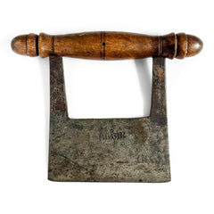 A Victorian kitchen chopper with a turned beechwood handle and carbon steel blade.