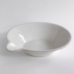 A super-large Victorian ironstone dairy pouring bowl by the "Dairy Supply Company London" (stamp applied to underside) with a rolled rim and a particularly striking pouring lip.