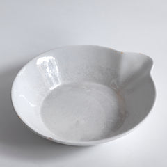 A large Victorian ironstone dairy pouring bowl with a particularly striking pouring lip.