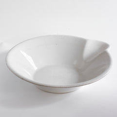 A super-large Victorian ironstone dairy pouring bowl by the "Dairy Supply Company London" (stamp applied to underside) with a rolled rim and a particularly striking pouring lip.