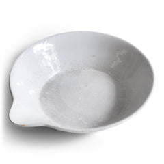 A large Victorian ironstone dairy pouring bowl with a particularly striking pouring lip.