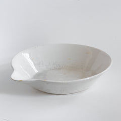 A large Victorian ironstone dairy pouring bowl with a particularly striking pouring lip.