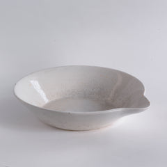 A large Victorian ironstone dairy pouring bowl with a particularly striking pouring lip.