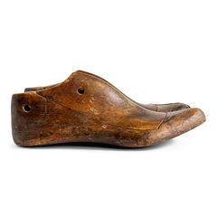 A pair of mid nineteenth century polished wooden shoe lasts with leather toe-capped sides and excellent historical patina.