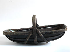 An extra-large rustic antique trug, with a particularly pleasing historic sheet-metal repair to its interior, and a lovely patina formed from decades of use.
