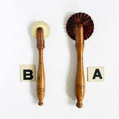 Two Victorian pastry cutting wheels, each with a polished turned boxwood handle. The smaller has a bone carved wheel, the larger wheel is made from wood 