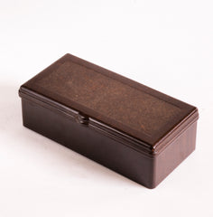 A 1930s Bakelite box with a hinged lid that has an integrated Bakelite hinge. 